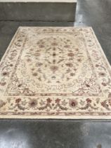 A cream ground wool carpet. 122" x 96"