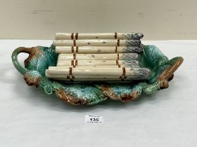 A French majolica asparagus cradle, possibly Creil and Montereau. 15" wide.