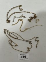 Four yellow metal necklet chains. Unmarked.