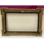 A 19th century gilt mirror or picture frame, with egg and dart moulded decoration. 30" x 44½".