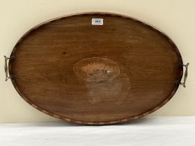 An Edward VII mahogany and shell inlaid mahogany oval tray with chequered gallery and brass handles.