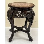 A late 19th century Chinese carved rosewood pot stand with marble inlet top 19" high. Two leg