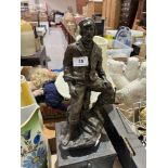 A cast resin figure of a man after John Letts. 12½" high.