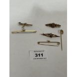 A 14ct brooch; two 9ct bar brooches and a 9ct horseshoe pin, 6g gross; with two unmarked brooches.