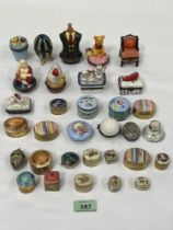 A collection of ceramic and other pill boxes, bonbonnieres etc.
