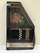 A European zither decorated with roses to the sound board. 20" high.