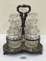 A 19th century plated decanter frame with three cut glass mallet decanters. 11½" high.
