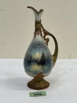 A Royal Worcester ewer, gilded and painted with a seascape to each side by Raymond Rushton. Shape