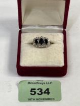 A 9ct sapphire and diamond ring. 2.6g gross. Size N.