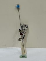 Five hatpins to include an example by Charles Horner of Shamrock form and another in silver and