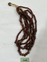 A four strand necklace of amber beads. 128g.