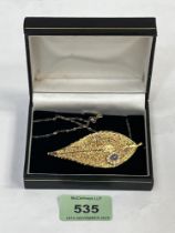 A gold plated leaf brooch pendant on 9ct necklet chain.