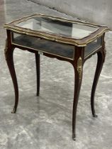 A Victorian rosewood and gilt brass mounted bijouterie table retailed by James Shoolbred and Co,