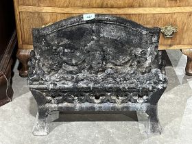 A cast iron fire grate. 17" wide.