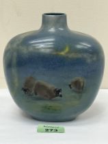 A Royal Doulton Titanian oviod vase, decorated by Harry Allen with three sheep in a landscape.