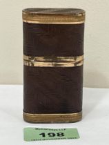 A 19th century leather bound and gilt metal mounted etui. 3¼" high.