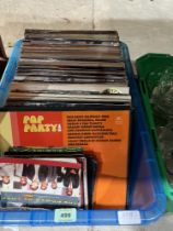A box of LP records and singles.