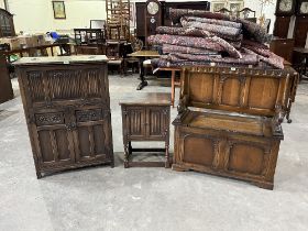 An oak table bench; a cocktail cabinet and a cabinet. (3)