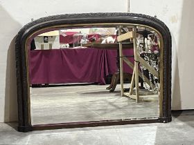 A Victorian overmantle mirror with bevelled plate. 33" x 45".