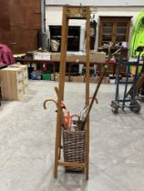 An oak hatstand and a stick stand and contents.