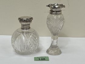 A cut glass silver topped scent bottle, 3¾" high and a silver mounted cut glass vase.