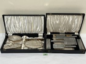 An Elizabeth II cased silver four piece dressing table set Birmingham 1966, and an Art - Deco plated