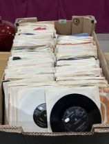 A box of over 225 1960s 7" vinyl records.