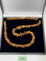 A necklace of amber naturalistic beads. 26" long, 42.7g.