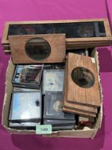 A box of 19th century coloured magic lantern slides.