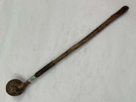 An Asian or African knobkerrie, the shaft with a series of notches. 24½" long.