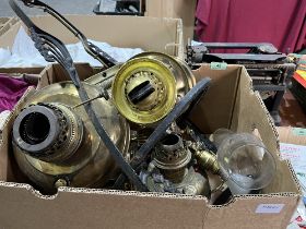 A box of brass oil lamps etc.