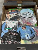 A box of picture discs etc.