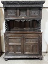 A Victorian antiquarian taste joined oak press cupboard. Elements 17th century but constructed in