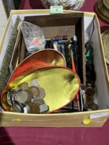 A box of coins and sundries.