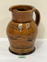 A glazed earthenware 'Seasons' jug, decorated with a village in a landscape. 9" high.