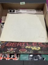 A box of Beatles LPs, EPs and 7" singles including Tony Sheridan and Beatles.