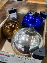 Three metalised glass baubles. 7" diam and smaller.