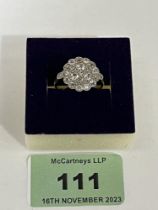 An old cut diamond millegrain set cluster ring. In gold, marks rubbed. 4g gross. Size M.