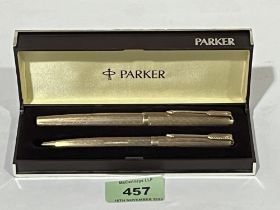 A cased Parker 9ct fountain pen and ballpoint pen en-suite.