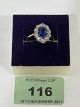 A sapphire and diamond ring. In gold marked 18ct. 4g gross. Size N.