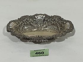 A white metal pierced and repousse scroll decorated dish. 6¼" wide. Apparently unmarked. 2ozs