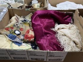 A box of lace and other textiles.