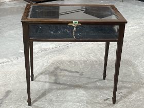 An Edward VII mahogany line inlaid bijouterie table raised on square tapered legs. 30½" wide.