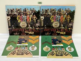 Two Beatles Sgt Pepper's albums, both with inserts.