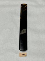 A Victorian tortoiseshell page turner with applied silver monogram. 13¾" long.