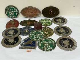 A collection of equestrian metal plaques.