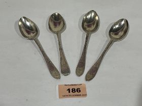 A set of three George V silver bright cut teaspoons, Sheffield 1919 and George IV example, London