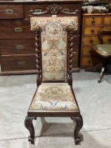 A Victorian mahogany and tapestry side chair, the high back with spiral turned pilasters on volute