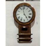 A walnut and inlaid drop cased wall clock with American movement. 30" high.