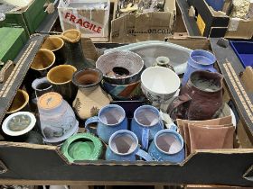 A box of studio pottery.